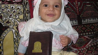 Muslim Baby Girl with Holy Qur