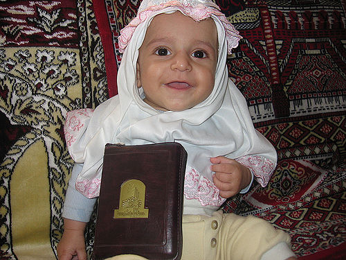 Muslim Baby Girl with Holy Qur
