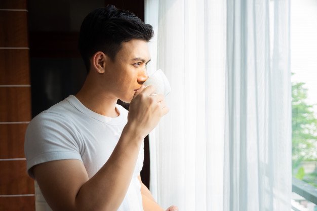 young man drink coffee home 1150 14240